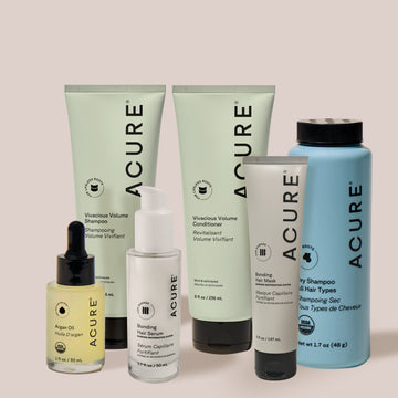 Acure hair care product set on a light background